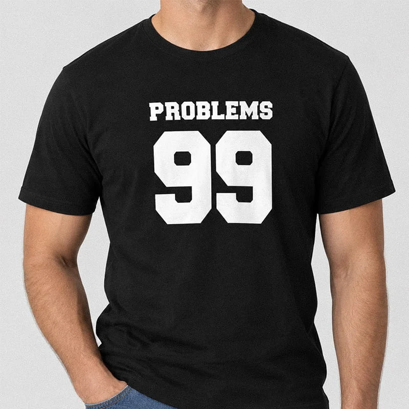 Man wearing a black 99 Problems Ain’t 1 T-Shirt - Funny Couples Matching Shirt for Him with large bold white text reading PROBLEMS 99