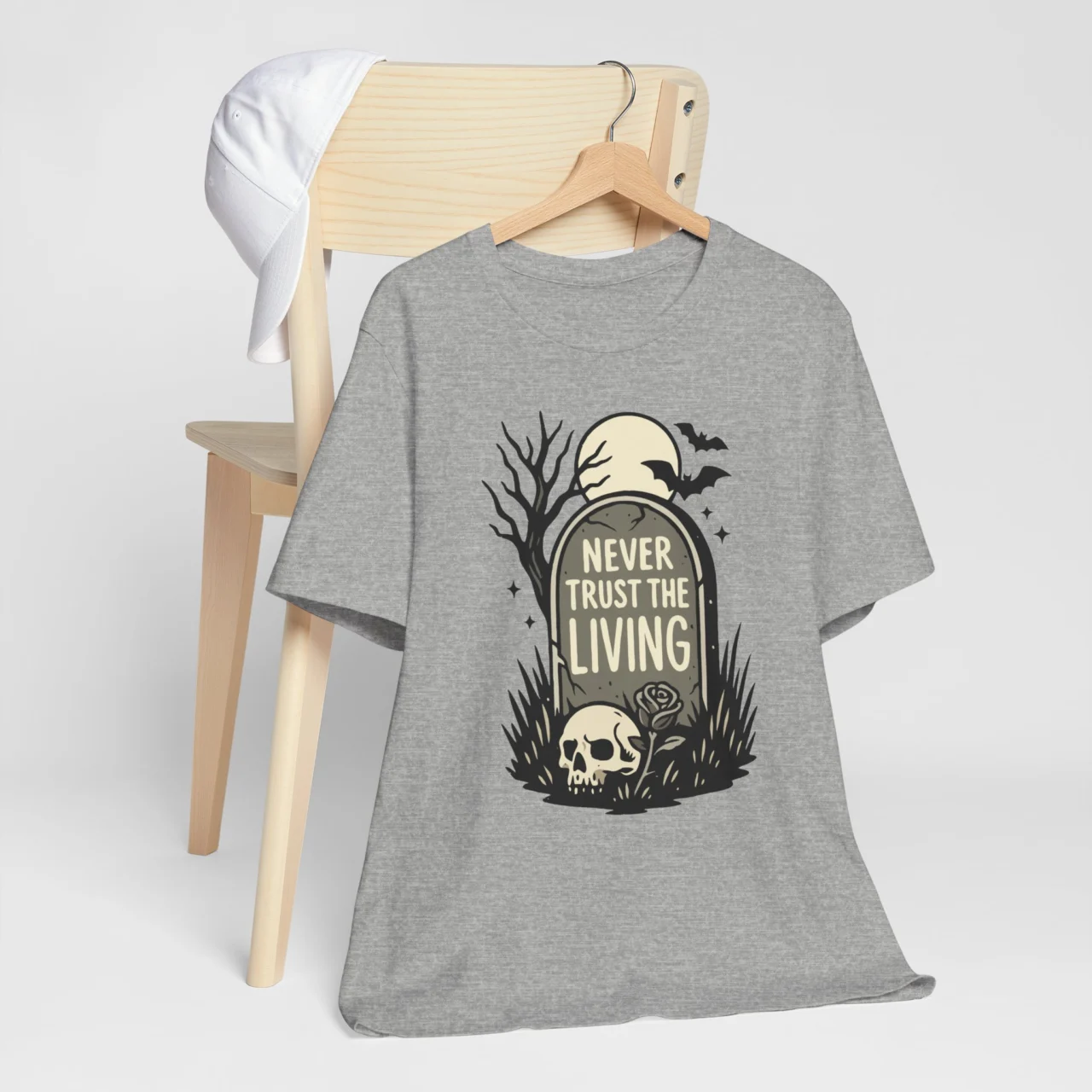 Black gothic t-shirt with skull and gravestone design that says Never Trust the Living shirt