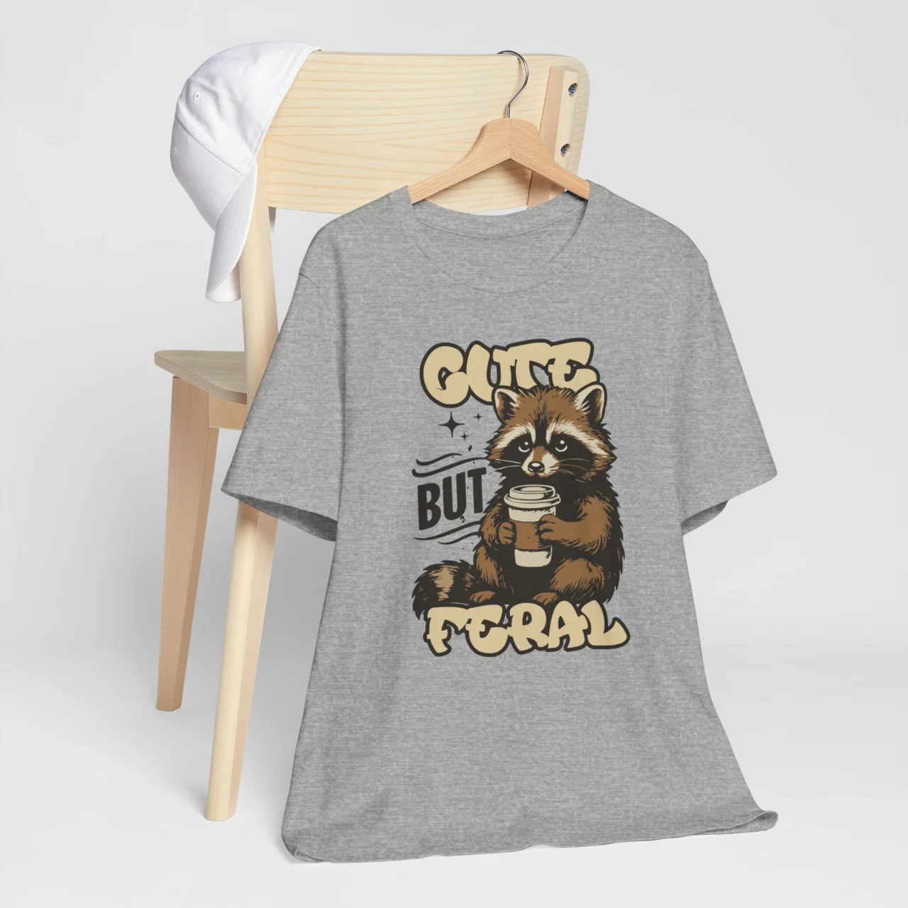 Funny raccoon t-shirt with Cute But Feral shirt phrase, casual animal humor shirt.