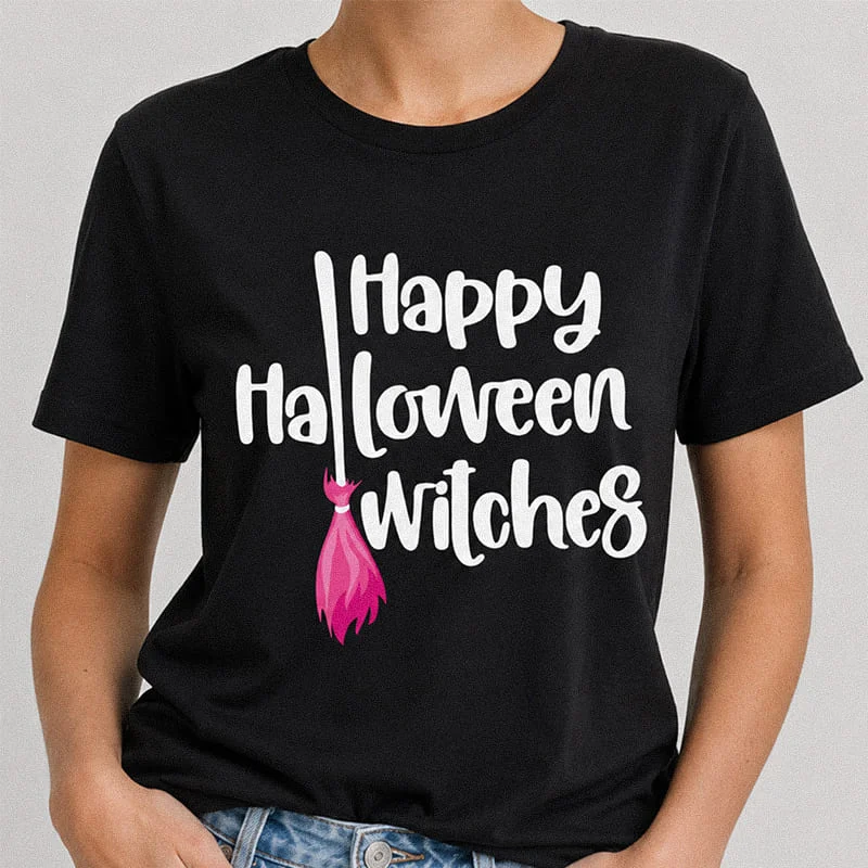 Woman wearing a black Happy Halloween Witches Shirt - Funny Witch Graphic Tee featuring white bold typography and a bright pink witch broomstick