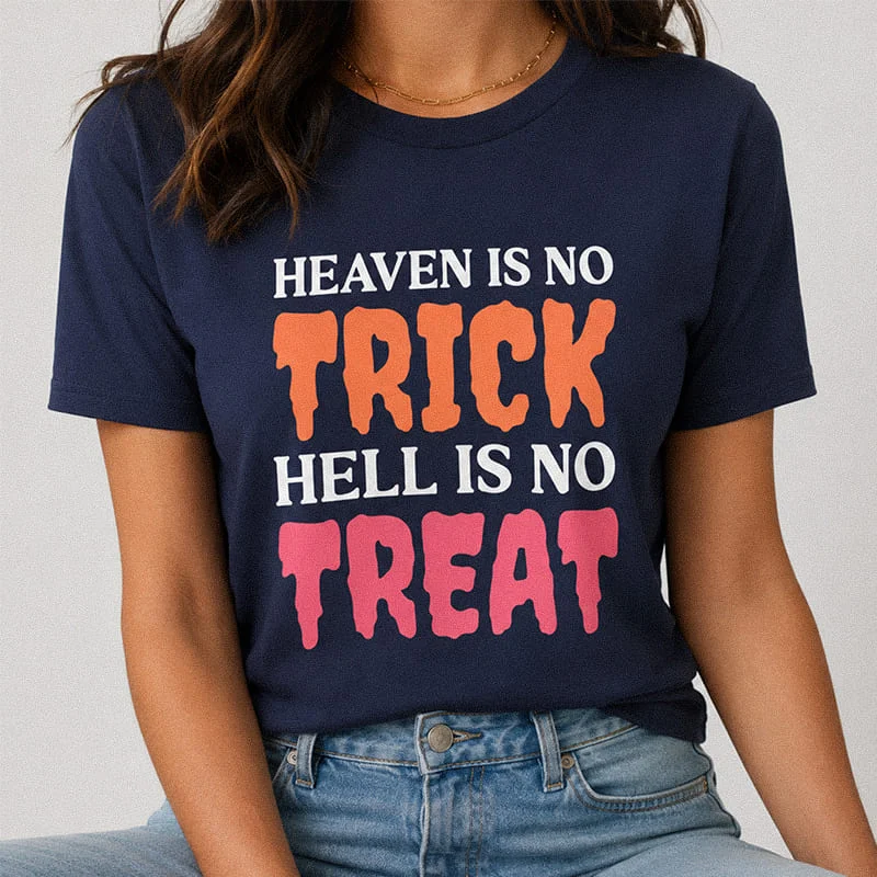 Woman wearing a navy blue Heaven Is No Trick Hell Is No Treat Shirt - Christian Halloween Shirt featuring bold colorful dripping text