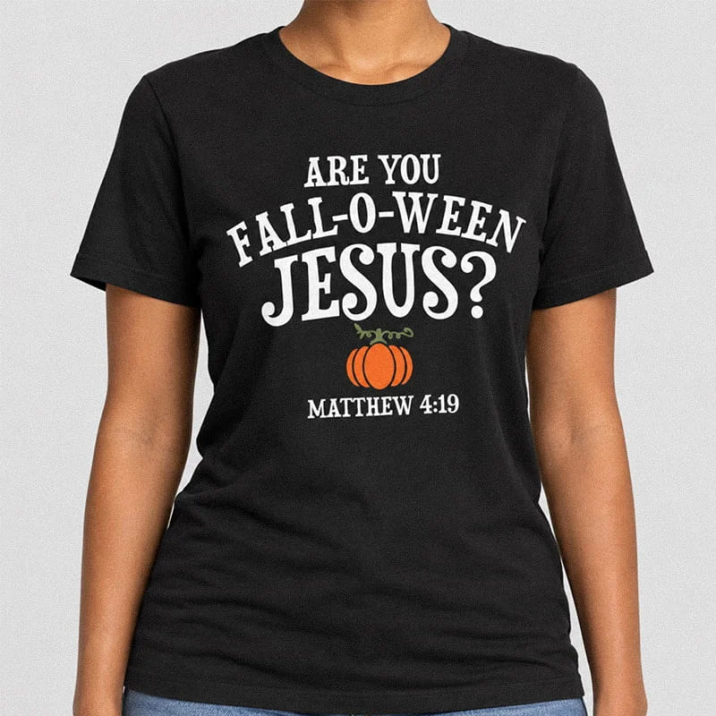 Woman wearing a black Are You Fall-O-Ween Jesus Shirt - Funny Religious Halloween Tee with white text reading Are You Fall-O-Ween Jesus? with an orange pumpkin and Bible verse Matthew 4:19