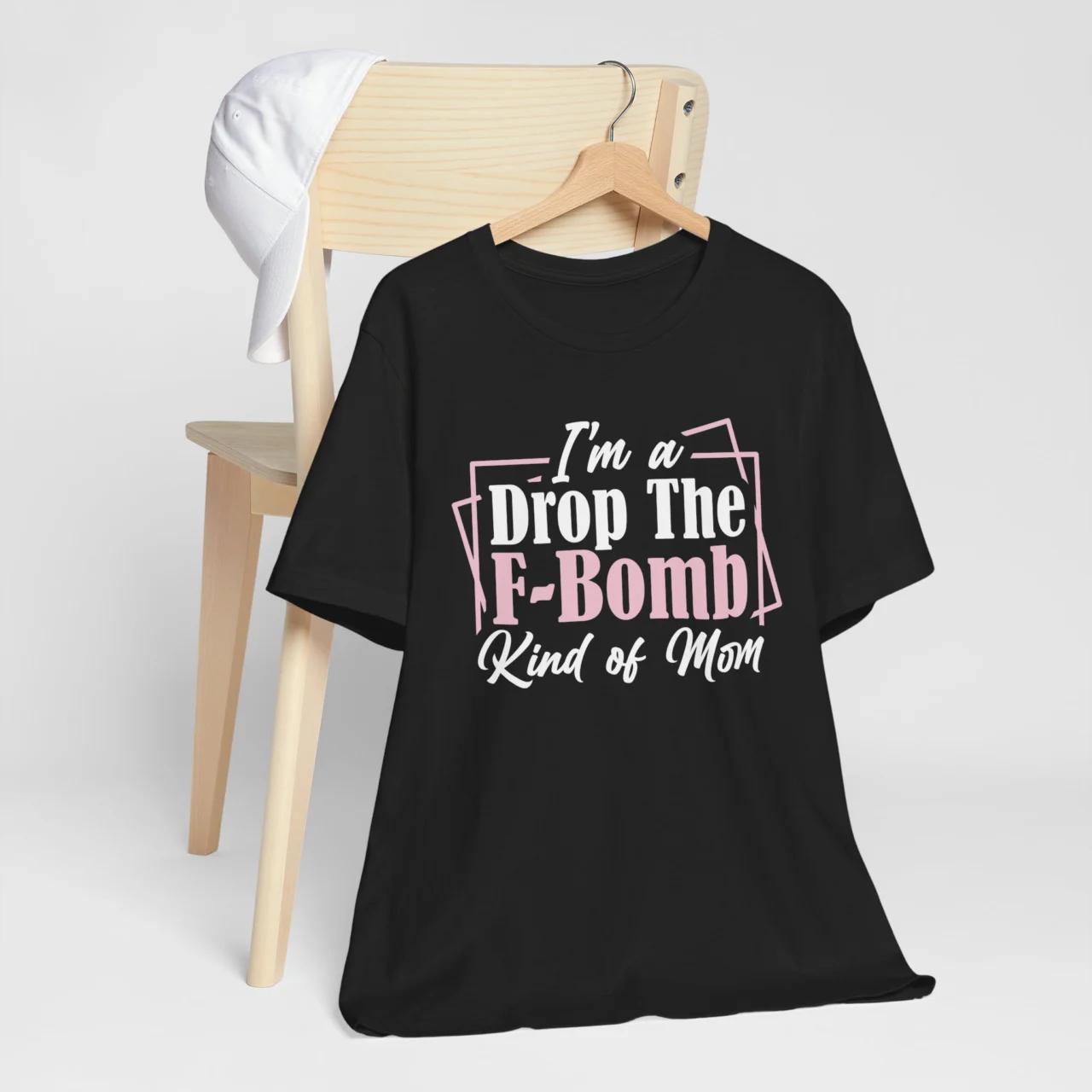 I'm A Drop The F-Bomb Kind Of Mom Funny Graphic Tee - Sarcastic Shirt in Black with Pink Text