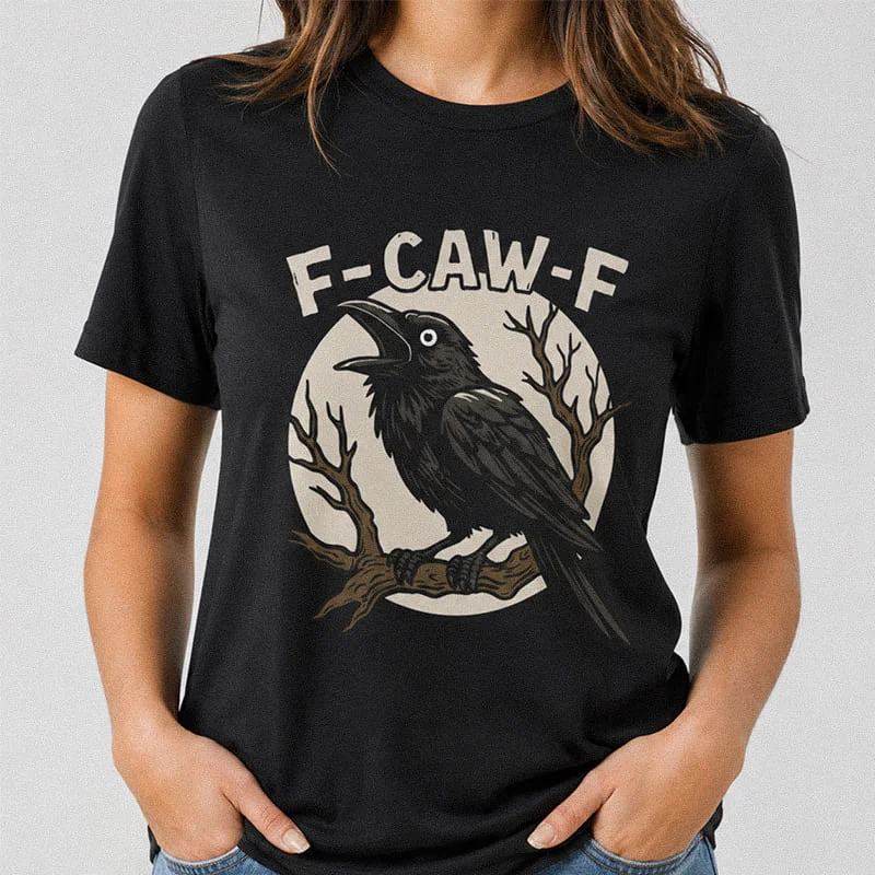 Woman wearing a black F-Caw-F Funny Crow Shirt - Black Crow Graphic Tee featuring a crow perching on a tree branch in front of a full moon