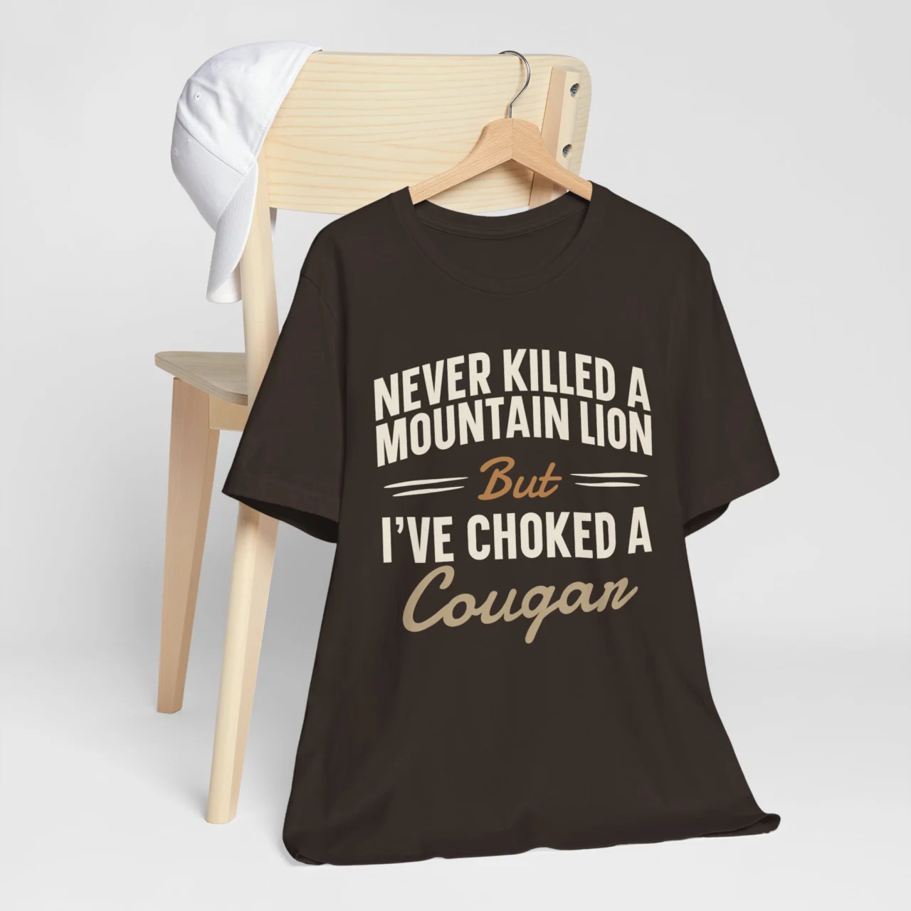 Never Killed A Mountain Lion Choked A Cougar Tee - Funny Adult Humor Graphic Shirt in Brown