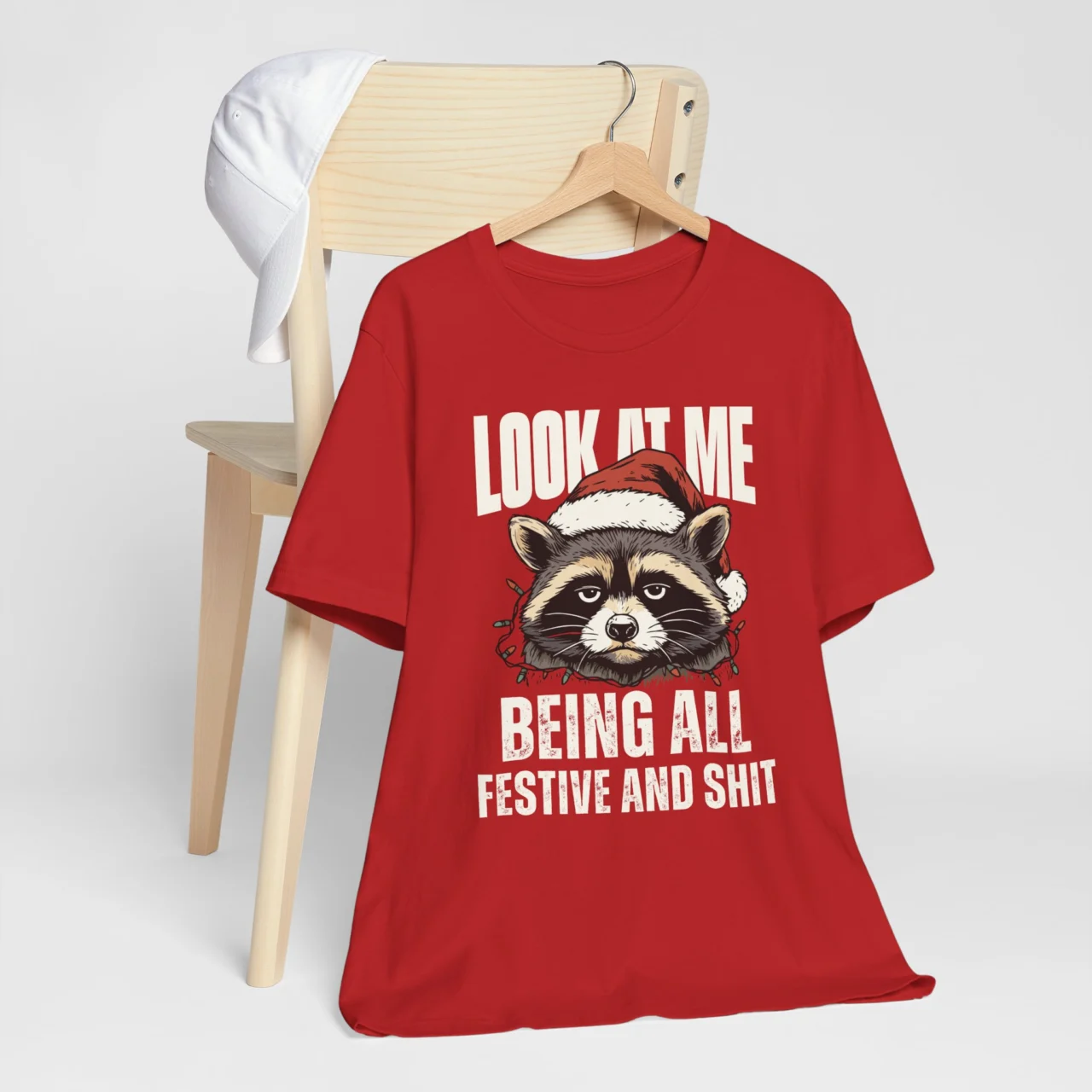 Look at Me Being All Festive Shirt with a grumpy raccoon wearing a Santa hat and lights, a Funny Sarcastic Christmas Tee design.