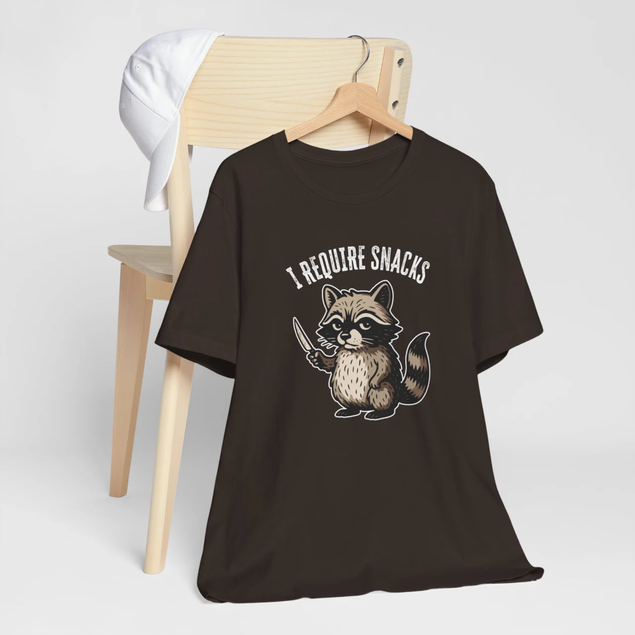 I Require Snacks Funny Raccoon Graphic Tee in Brown