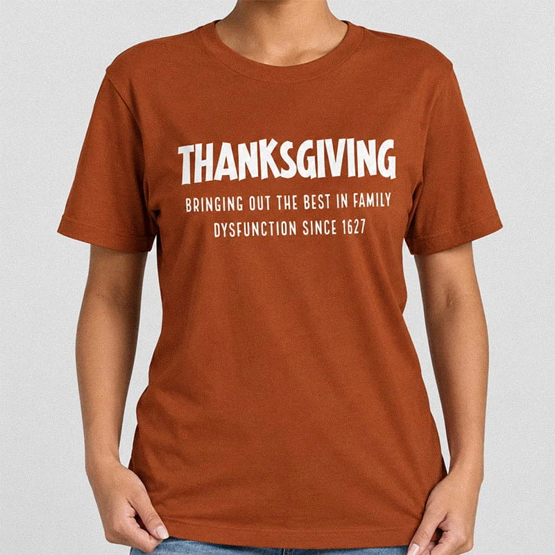 Woman wearing a rust Thanksgiving Family Dysfunction Shirt - Funny Sarcastic Holiday Tee with text reading Thanksgiving Bringing Out The Best In Family Dysfunction Since 1627