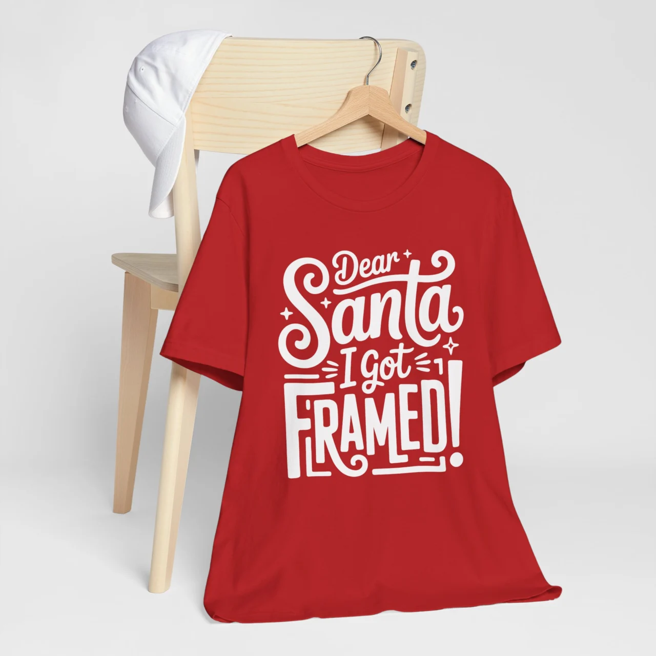 Dear Santa I Got Framed Shirt in bold white festive typography on a red t-shirt, a Funny Sarcastic Naughty List Tee design.